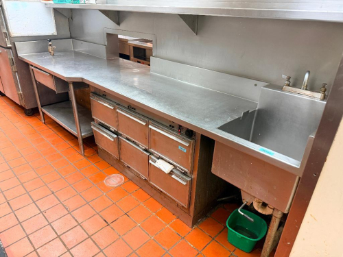 138" L STAINLESS STEEL WORKTABLE ASSEMBLY WITH INTEGRATED DEEP SINK, FAUCET, CAN OPENER, RAISED BACKSPLASH, PASS-THROUGH OPENING, UNDERSHELF, DRAWER, AND STAINLESS STEEL LEGS. COUNTERTOP IS FORMED AROUND EXISTING EQUIPMENT LOCATIONS. EQUIPMENT SHOWN BENEA