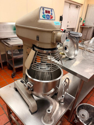 COMMERCIAL 20-QUART PLANETARY MIXER WITH STAINLESS STEEL MIXING BOWL, WIRE WHIP, FLAT BEATER, DOUGH HOOK, SAFETY BOWL GUARD, DIGITAL TIMER CONTROLS, AND MANUAL BOWL LIFT. CAST METAL BODY WITH FLOOR/TABLE-MOUNT STYLE BASE.
