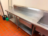 14' L X 28" D STAINLESS STEEL COMMERCIAL WORKTABLE AND TWO-COMPARTMENT SINK ASSEMBLY WITH INTEGRAL BACKSPLASH, LARGE WORK SURFACES, TWO DEEP SINK COMPARTMENTS, WALL-MOUNT FAUCET, TWO DRAWERS, LOWER STAINLESS STEEL STORAGE SHELVES, AND TUBULAR LEGS. - 4