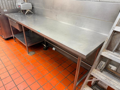 108" W X 28" D STAINLESS STEEL WORK TABLE WITH FULL-LENGTH REAR BACKSPLASH, HEAVY-DUTY TUBULAR LEGS, ADJUSTABLE FEET AND LOWER UNDERSHELF