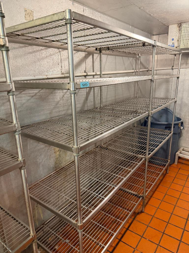 (2) 48" W X 24" D WIRE SHELVING UNITS WITH SHARED CENTER SUPPORT POLES. EACH UNIT INCLUDES MULTIPLE ADJUSTABLE OPEN-WIRE SHELVES WITH METAL UPRIGHT POSTS AND COLLAR-STYLE SHELF CONNECTIONS