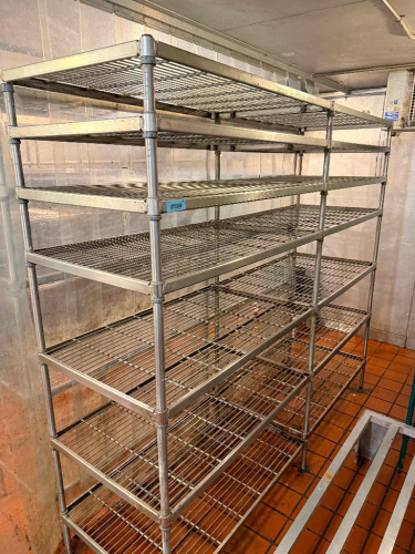 (2) 48" W X 24" D WIRE SHELVING UNITS WITH SHARED CENTER SUPPORT POLES. EACH UNIT INCLUDES MULTIPLE ADJUSTABLE OPEN-WIRE SHELVES WITH METAL UPRIGHT POSTS AND COLLAR-STYLE SHELF CONNECTIONS