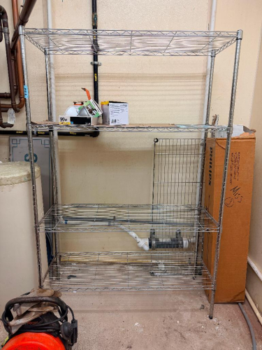 48" W X 18" CHROME WIRE SHELVING UNIT WITH FOUR ADJUSTABLE WIRE SHELVES AND FOUR POST CONSTRUCTION.