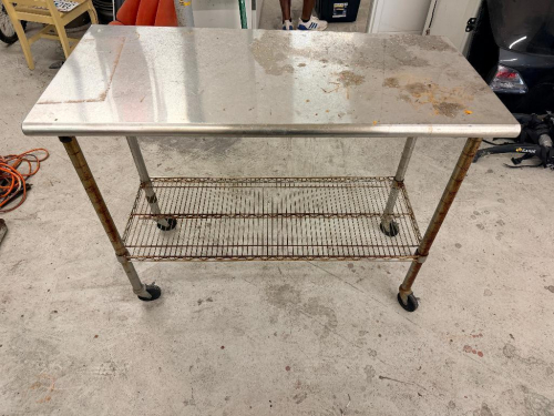 (1) STAINLESS STEEL WORK TABLE WITH LOWER WIRE SHELF