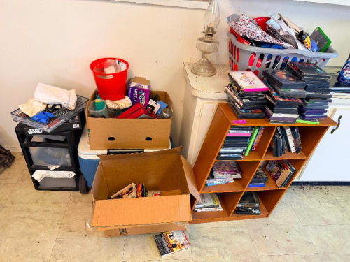 (1) ASSORTED LOT OF DVDS, VIDEO GAMES, BOOKS, SHELVING & HOUSEHOLD ITEMS