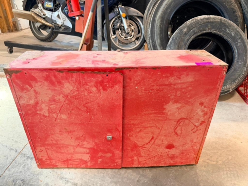 (1) RED METAL 2-DOOR STORAGE CABINET