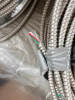 SEVERAL BUNDLES LOT OF FLEXIBLE METAL ELECTRICAL CONDUIT - APPROX 200 LINEAR FT. - 2