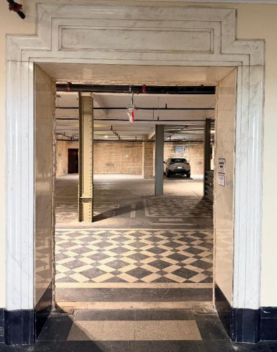 62" WHITE MARBLE DOOR SURROUND WITH MATCHING THRESHOLD AND DECORATIVE TRIM / MOLDING. INCLUDES REMOVED MARBLE COMPONENTS SHOWN. FROM ORIGINAL 1929 BUILDING CONSTRUCTION.