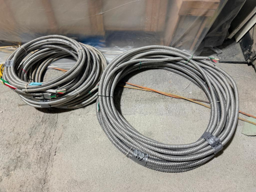 SEVERAL BUNDLES LOT OF FLEXIBLE METAL ELECTRICAL CONDUIT - APPROX 100 LINEAR FT.