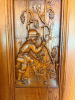 CUSTOM-BUILT SOLID OAK DOUBLE ENTRY DOOR ASSEMBLY WITH EXTENSIVE RELIEF-CARVED WINE AND VINEYARD SCENES, RAISED-PANEL CONSTRUCTION, DECORATIVE BRASS-TONE HARDWARE, HEAVY OAK CASING, AND MATCHING TALL LEADED STAINED-GLASS SIDELIGHTS. DECORATIVE GRAPE AND V - 3