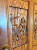 CUSTOM-BUILT SOLID OAK DOUBLE ENTRY DOOR ASSEMBLY WITH EXTENSIVE RELIEF-CARVED WINE AND VINEYARD SCENES, RAISED-PANEL CONSTRUCTION, DECORATIVE BRASS-TONE HARDWARE, HEAVY OAK CASING, AND MATCHING TALL LEADED STAINED-GLASS SIDELIGHTS. DECORATIVE GRAPE AND V - 5