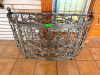 48" W X 17" D DECORATIVE WROUGHT IRON DEMILUNE CONSOLE TABLE BASE WITH ORNATE SCROLLWORK, ACANTHUS LEAF ACCENTS, PINECONE FINIALS AND CURVED FRONT. OPEN METAL FRAME CONSTRUCTION WITH DECORATIVE FRONT AND SIDE PANELS. TABLE TOP NOT INCLUDED.