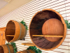 (5) WALL-MOUNTED HALF-BARREL DISPLAY SHELVES CONSTRUCTED FROM WOOD BARRELS WITH METAL HOOPS. EACH BARREL HAS AN OPEN FRONT WITH WOOD INTERIOR DISPLAY SHELF. INCLUDES WALL-MOUNTING HARDWARE - 4