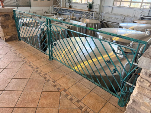 60 LINEAR FT OF CUSTOM DECORATIVE METAL SAFETY RAILING WITH DIAGONAL BAR PATTERN, GRAPE AND VINE ACCENTS, TOP AND BOTTOM RAILS, AND FLOOR-MOUNTED POSTS. GREEN TEXTURED FINISH.