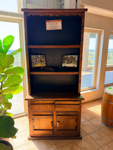 VINTAGE RUSTIC WOOD HUTCH / DISPLAY CABINET WITH OPEN UPPER SHELVING, TWO LOWER DRAWERS, AND TWO LOWER CABINET DOORS WITH METAL HARDWARE.