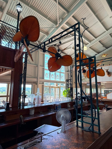 (1) FANTIMATION PALISADE DUAL-MOTOR CEILING FANS WITH LARGE TROPICAL-STYLE WOVEN LEAF BLADES, MOUNTED TO DECORATIVE METAL OVERHEAD FRAMEWORK
