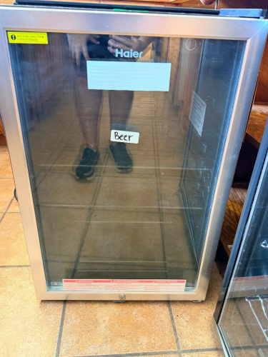 HAIER BEVERAGE CENTER WITH GLASS FRONT DOOR, STAINLESS-FINISH DOOR FRAME, ADJUSTABLE TEMPERATURE CONTROL, INTERIOR SHELVING, AND KEY LOCK