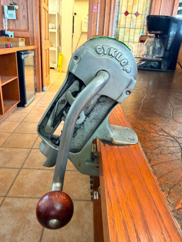 (3) GYKLOP HEAVY-DUTY MANUAL BENCH-MOUNTED WINE BOTTLE CORKER WITH CAST METAL FRAME, LONG LEVER HANDLE, ADJUSTABLE BOTTLE PLATFORM, CORK COMPRESSION MECHANISM, AND COUNTER CLAMP.