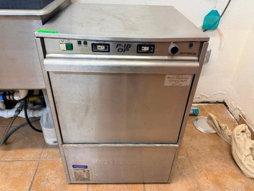 JET TECH SYSTEMS F-18 COMMERCIAL UNDERCOUNTER HIGH-TEMPERATURE DISHWASHER WITH STAINLESS STEEL CONSTRUCTION, FRONT DROP-DOWN DOOR, WASH AND RINSE TEMPERATURE GAUGES, AND DISH RACK.