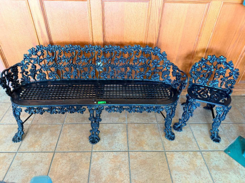 ORNATE CAST METAL GARDEN BENCH AND MATCHING CHAIR WITH GRAPE VINE, GRAPE CLUSTER, AND LEAF PATTERN. BENCH FEATURES LATTICE-STYLE SEAT, MATCHING CHAIR FEATURES OPENWORK SEAT AND DECORATIVE LEGS.