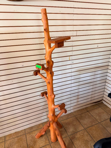 FAUX TREE TRUNK SHELVING DISPLAY.