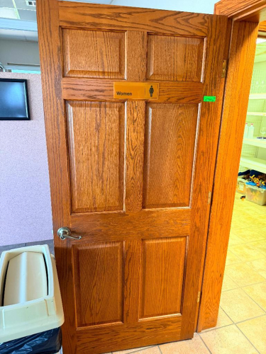 (3) SOLID OAK SIX-PANEL INTERIOR DOOR WITH MATCHING OAK DOOR FRAME AND DECORATIVE CASING/TRIM. LEVER-STYLE DOOR HARDWARE INCLUDED.
