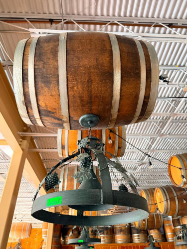 DECORATIVE HANGING WOODEN BARREL LIGHT FIXTURE WITH METAL HOOPS, CIRCULAR METAL LIGHT FRAME, AND DECORATIVE GRAPE VINE, LEAF, AND GRAPE CLUSTER ACCENTS. 20" SHADE.
