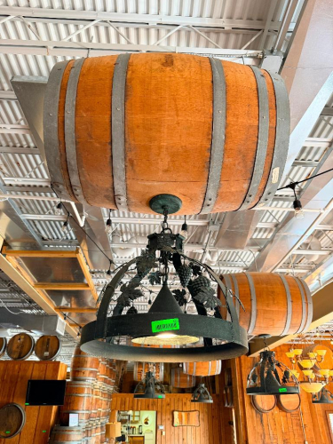 DECORATIVE HANGING WOODEN BARREL LIGHT FIXTURE WITH METAL HOOPS, CIRCULAR METAL LIGHT FRAME, AND DECORATIVE GRAPE VINE, LEAF, AND GRAPE CLUSTER ACCENTS. 20" SHADE.