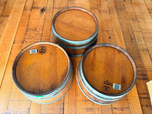 (3) WOOD WINE BARRELS MOUNTED HORIZONTALLY TO WALL, WITH WOOD STAVE CONSTRUCTION AND METAL HOOPS.