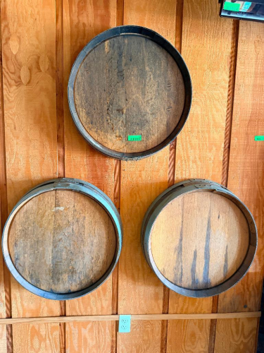 (3) WOOD WINE BARRELS MOUNTED HORIZONTALLY TO WALL, WITH WOOD STAVE CONSTRUCTION AND METAL HOOPS.