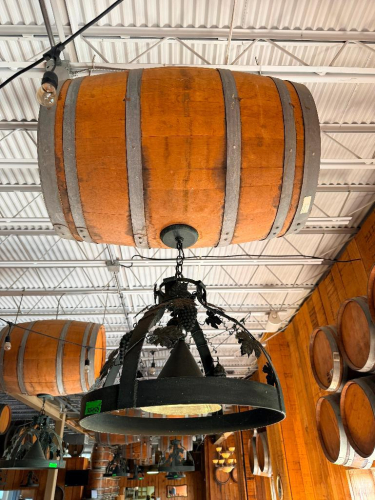 DECORATIVE HANGING WOODEN BARREL LIGHT FIXTURE WITH METAL HOOPS, CIRCULAR METAL LIGHT FRAME, AND DECORATIVE GRAPE VINE, LEAF, AND GRAPE CLUSTER ACCENTS. 20" SHADE.
