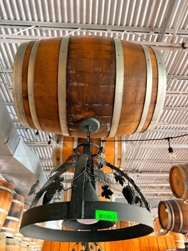 DECORATIVE HANGING WOODEN BARREL LIGHT FIXTURE WITH METAL HOOPS, CIRCULAR METAL LIGHT FRAME, AND DECORATIVE GRAPE VINE, LEAF, AND GRAPE CLUSTER ACCENTS. 20" SHADE.