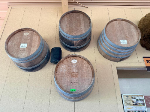 (4) WOOD WINE BARRELS MOUNTED HORIZONTALLY TO WALL, WITH WOOD STAVE CONSTRUCTION AND METAL HOOPS.
