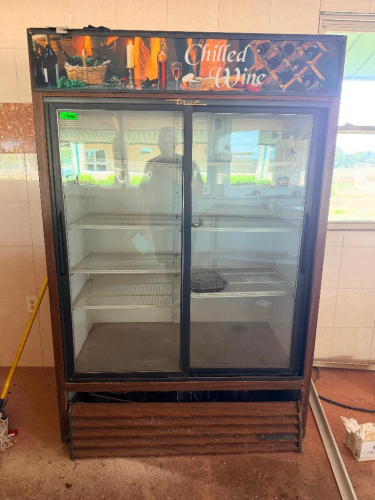 TRUE TWO-SECTION COMMERCIAL GLASS DOOR MERCHANDISER REFRIGERATOR WITH (2) SLIDING GLASS DOORS, ADJUSTABLE WIRE SHELVING, INTERIOR LIGHTING, CHILLED WINE HEADER AND WOOD-LOOK EXTERIOR TRIM.