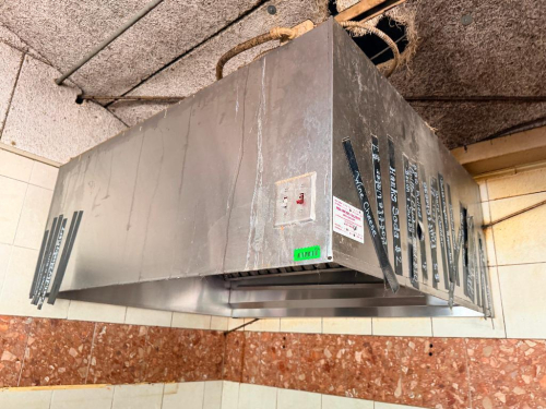 72" STAINLESS STEEL COMMERCIAL EXHAUST HOOD WITH REMOVABLE BAFFLE GREASE FILTERS AND INTEGRATED LIGHT FIXTURE.