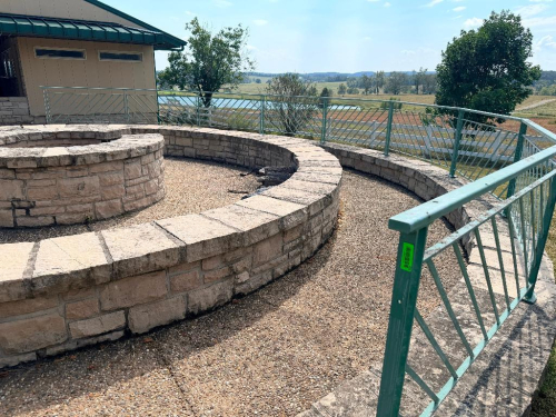 45 LINEAR FT. OF CUSTOM FABRICATED STEEL RAILING WITH DECORATIVE DIAGONAL PICKET DESIGN, SQUARE POSTS, TOP RAILS AND BASE PLATES. PAINTED GREEN FINISH.