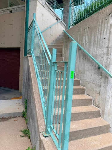 APPROX. 250 LINEAR FT. OF CUSTOM-FABRICATED STEEL GUARDRAIL / HANDRAIL SYSTEM WITH VERTICAL PICKETS, POSTS, TOP RAILS, MOUNTING BASE PLATES, AND STAIR RAILING SECTION. PAINTED GREEN FINISH.