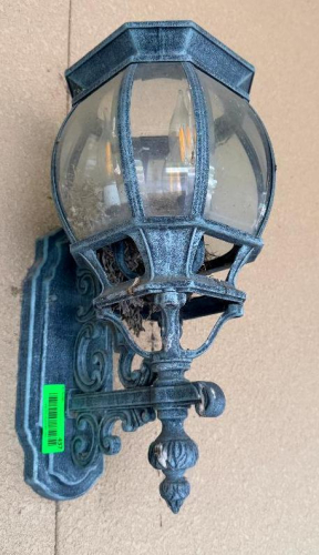 (6) DECORATIVE WALL-MOUNT LANTERN LIGHT FIXTURE WITH BLACK FINISH, ORNATE BACKPLATE AND SUPPORT BRACKET, CLEAR CURVED GLASS PANELS, AND MULTI-LIGHT CANDELABRA-STYLE INTERIOR.