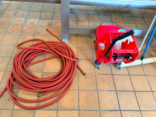 RED MOP BUCKET, 100' HEAVY DUTY HOSE, AND ASSORTED CLEANING SUPPLIES.