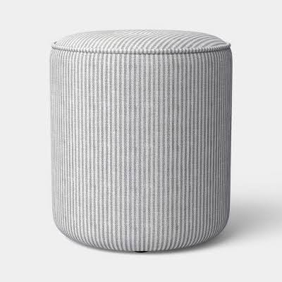 (1) UPHOLSTERED DRUM OTTOMAN