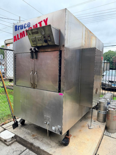 OLD HICKORY COMMERCIAL ROTISSERIE / BARBECUE OVEN WITH STAINLESS STEEL EXTERIOR, DOUBLE FRONT ACCESS DOORS, MULTIPLE INTERNAL COOKING RACKS, REAR FIREBOX ACCESS, ANALOG TEMPERATURE GAUGE, MANUAL TEMPERATURE CONTROL, INDICATOR LIGHTS, AND HEAVY-DUTY CASTER