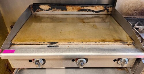 36" COMMERCIAL GAS GRIDDLE WITH FLAT STEEL COOKING SURFACE, THREE INDEPENDENT BURNER CONTROLS, STAINLESS STEEL FRONT, SIDE SPLASH GUARDS, REAR SPLASH GUARD, AND FRONT GREASE TROUGH.