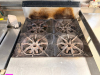 GARLAND COMMERCIAL GAS RANGE WITH FOUR OPEN TOP BURNERS AND STANDARD OVEN BASE. FEATURES HEAVY CAST-IRON BURNER GRATES, STAINLESS STEEL FRONT AND SIDES, REAR FLUE RISER, OVEN DOOR WITH FULL-WIDTH HANDLE, AND MULTIPLE OVEN RACKS. - 2