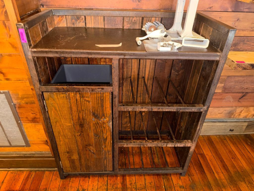 47" WIDE X 24" CUSTOM RUSTIC WOOD AND STEEL SERVICE STATION WITH RAISED THREE-SIDED BACK AND SIDE PANELS, SOLID WORK SURFACE, ENCLOSED STORAGE COMPARTMENT, OPEN LOWER STORAGE, AND DIVIDED VERTICAL STORAGE RACKS. HEAVY STEEL FRAME CONSTRUCTION WITH STAINED