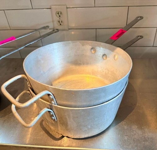 (2) 10" SAUCE POTS W/ HANDLES.