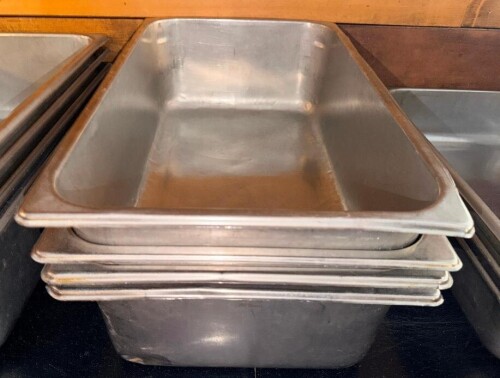 (4) FULL SIZE STAINLESS INSERTS.