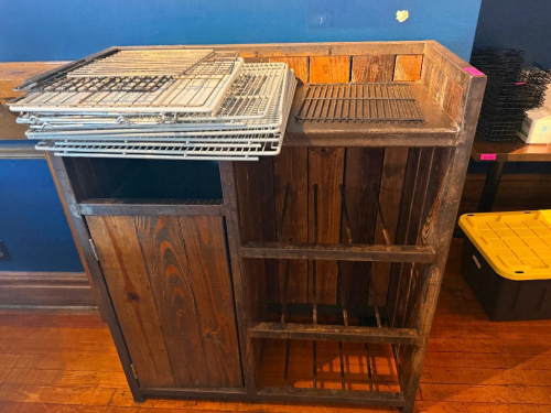 47" WIDE X 24" CUSTOM RUSTIC WOOD AND STEEL SERVICE STATION WITH RAISED THREE-SIDED BACK AND SIDE PANELS, SOLID WORK SURFACE, ENCLOSED STORAGE COMPARTMENT, OPEN LOWER STORAGE, AND DIVIDED VERTICAL STORAGE RACKS. HEAVY STEEL FRAME CONSTRUCTION WITH STAINED
