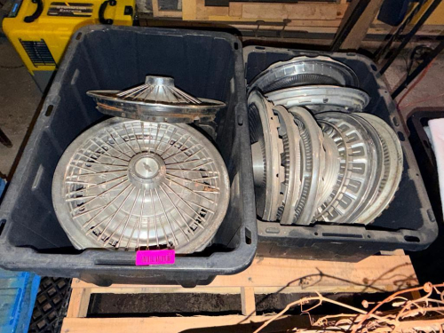 (2) BLACK CONTAINERS W/ CONTENTS - ASSORTED HUB CAPS.