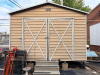 MORGAN PREFABRICATED METAL STORAGE BUILDING WITH GABLE ROOF, DOUBLE FRONT SWING DOORS, METAL SIDING, METAL ROOFING, SIDE WINDOWS/VENTS, AND STEEL FRAMING. BUILDING IS CURRENTLY ELEVATED ON CONCRETE BLOCKS. CONCRETE STEPS AND FIRE EXTINGUISHER - 2