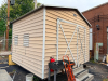 MORGAN PREFABRICATED METAL STORAGE BUILDING WITH GABLE ROOF, DOUBLE FRONT SWING DOORS, METAL SIDING, METAL ROOFING, SIDE WINDOWS/VENTS, AND STEEL FRAMING. BUILDING IS CURRENTLY ELEVATED ON CONCRETE BLOCKS. CONCRETE STEPS AND FIRE EXTINGUISHER - 5